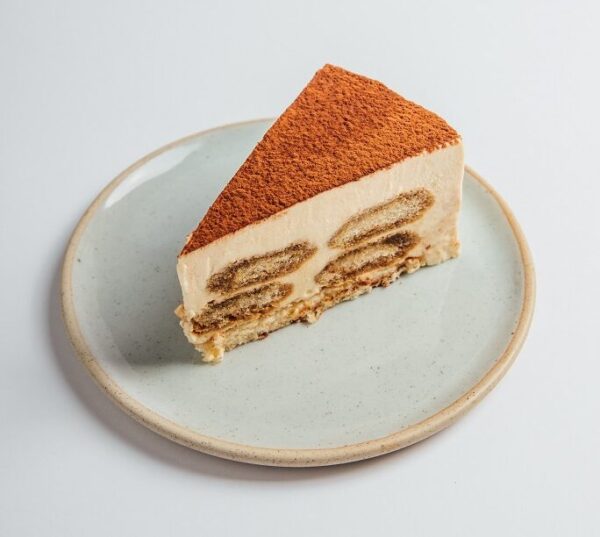 Tiramisu cake slice served on a plate