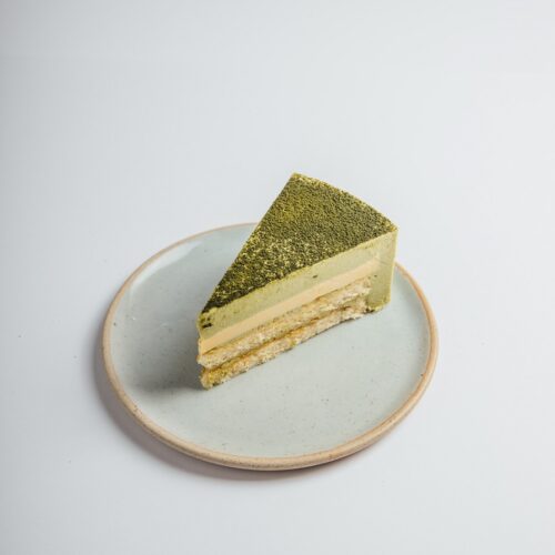 Matcha Yuzu cake slice served on a plate