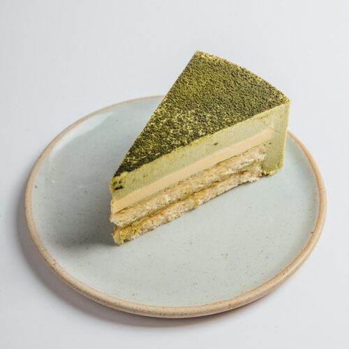 Matcha Yuzu cake slice served on a plate