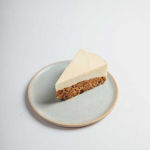 Vegan Carrot Cake Cheesecake slice served on a plate