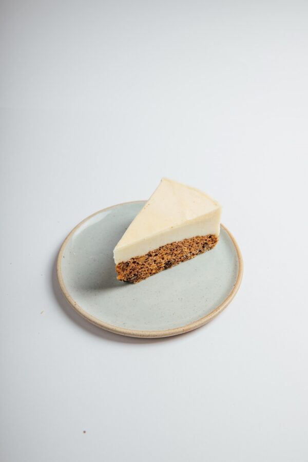 Vegan Carrot Cake Cheesecake slice served on a plate
