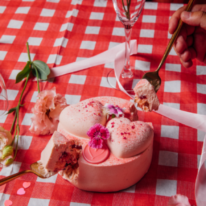Couple delighting in Strawberry Rose Pink Velvet Cake from Memo Cakery, Auckland