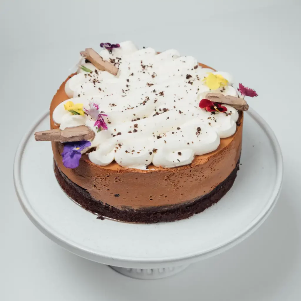 Vegan chocolate cheesecake with flowers 