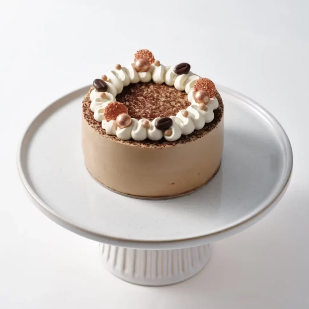 coffee rum and raisin cake with cream and cocoa